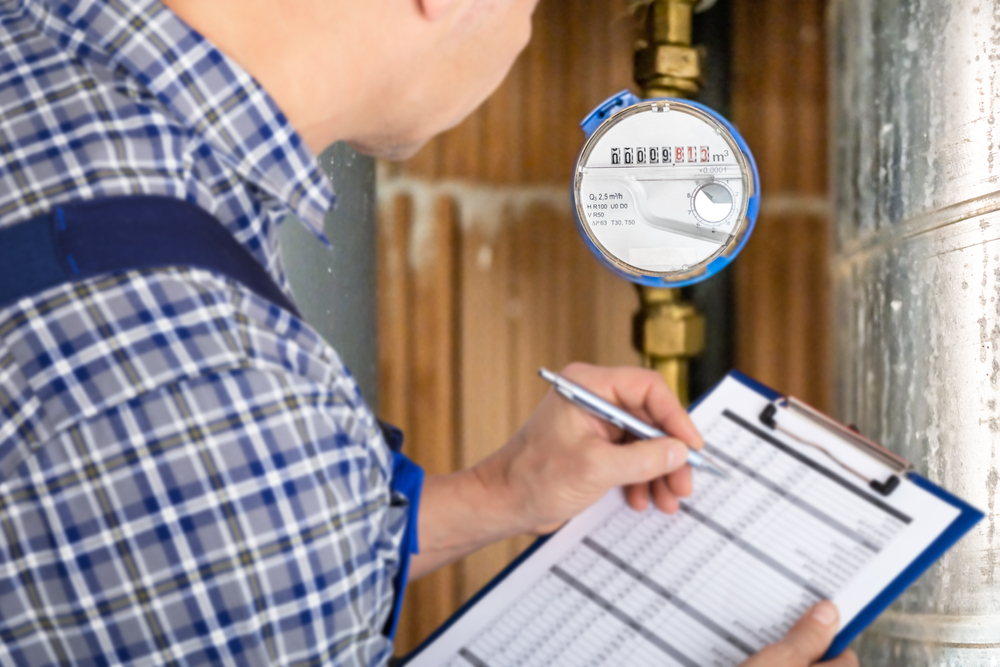 Technician,With,Clipboard,Reading,Water,Meter,Or,Counter