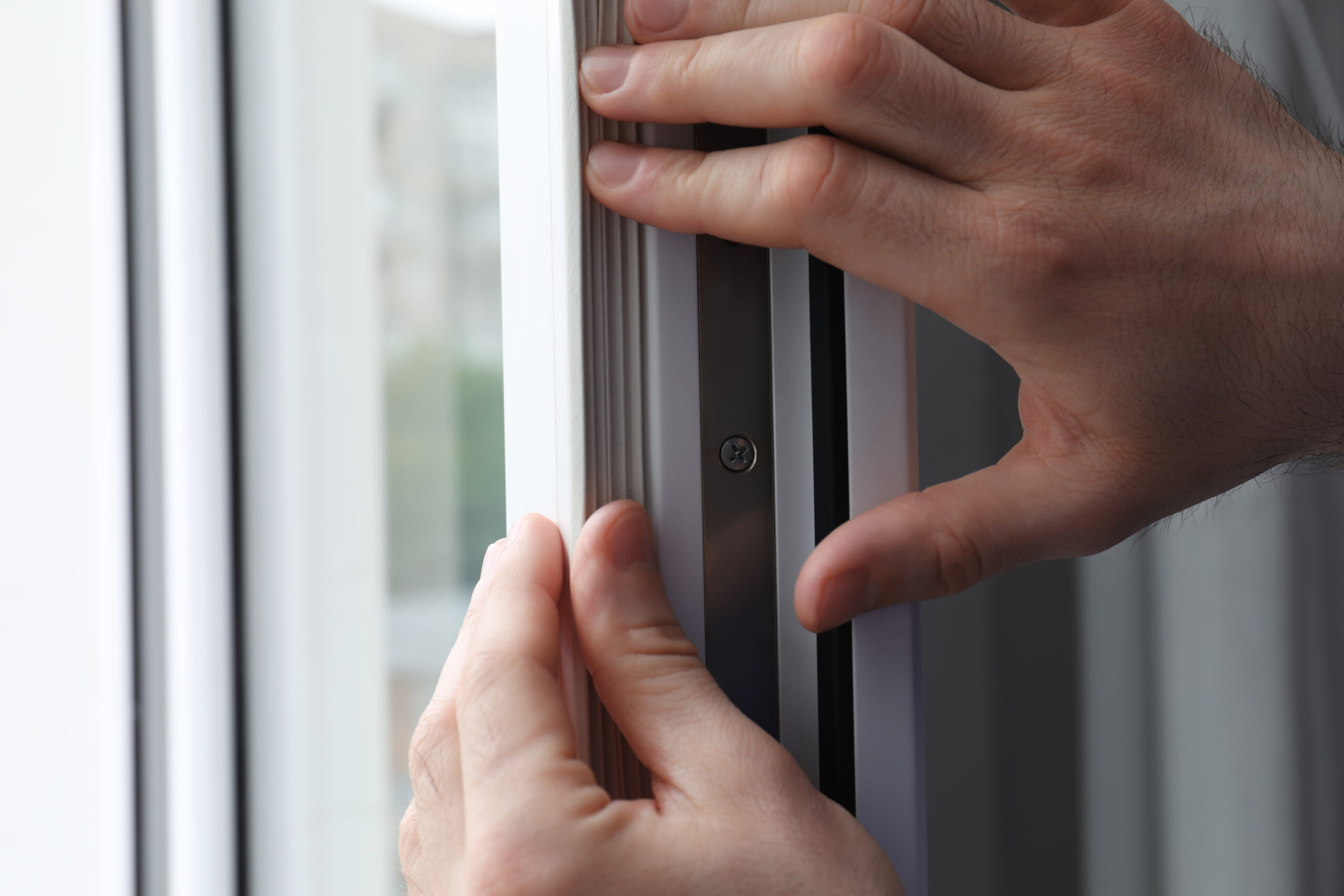 Worker,Putting,Rubber,Draught,Strip,Onto,Window,Indoors,,Closeup